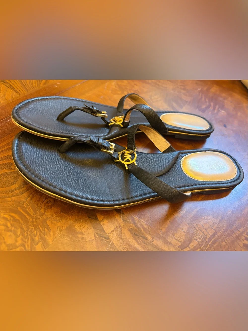 Michael Kors Black Leather T-Strap Sandals with Gold MK Medallions